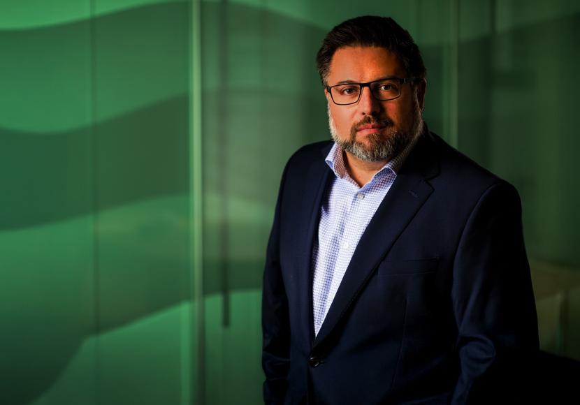 A business portrait of staff member Caleb Zunino